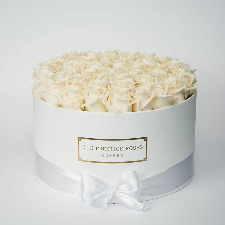Caja de flores frescas en tonos pastel para condolencias en Madrid